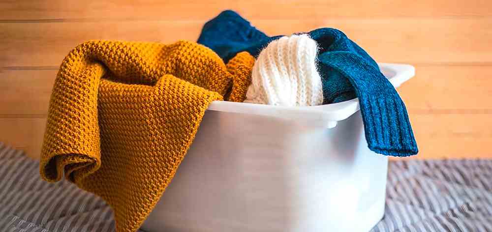 limpie el liquido de la prenda de lana de alpaca lo antes posible
